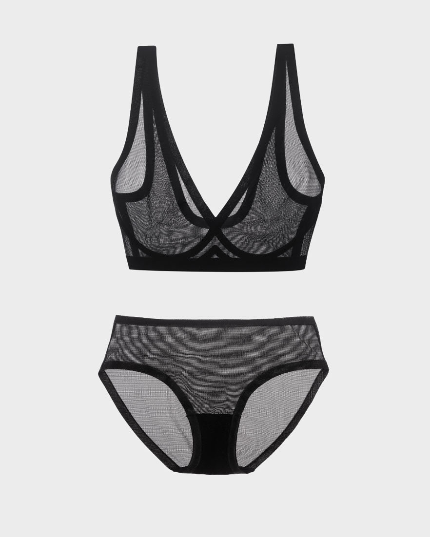 Black sheer bralette and matching mesh bikini panties set in a flat lay.
