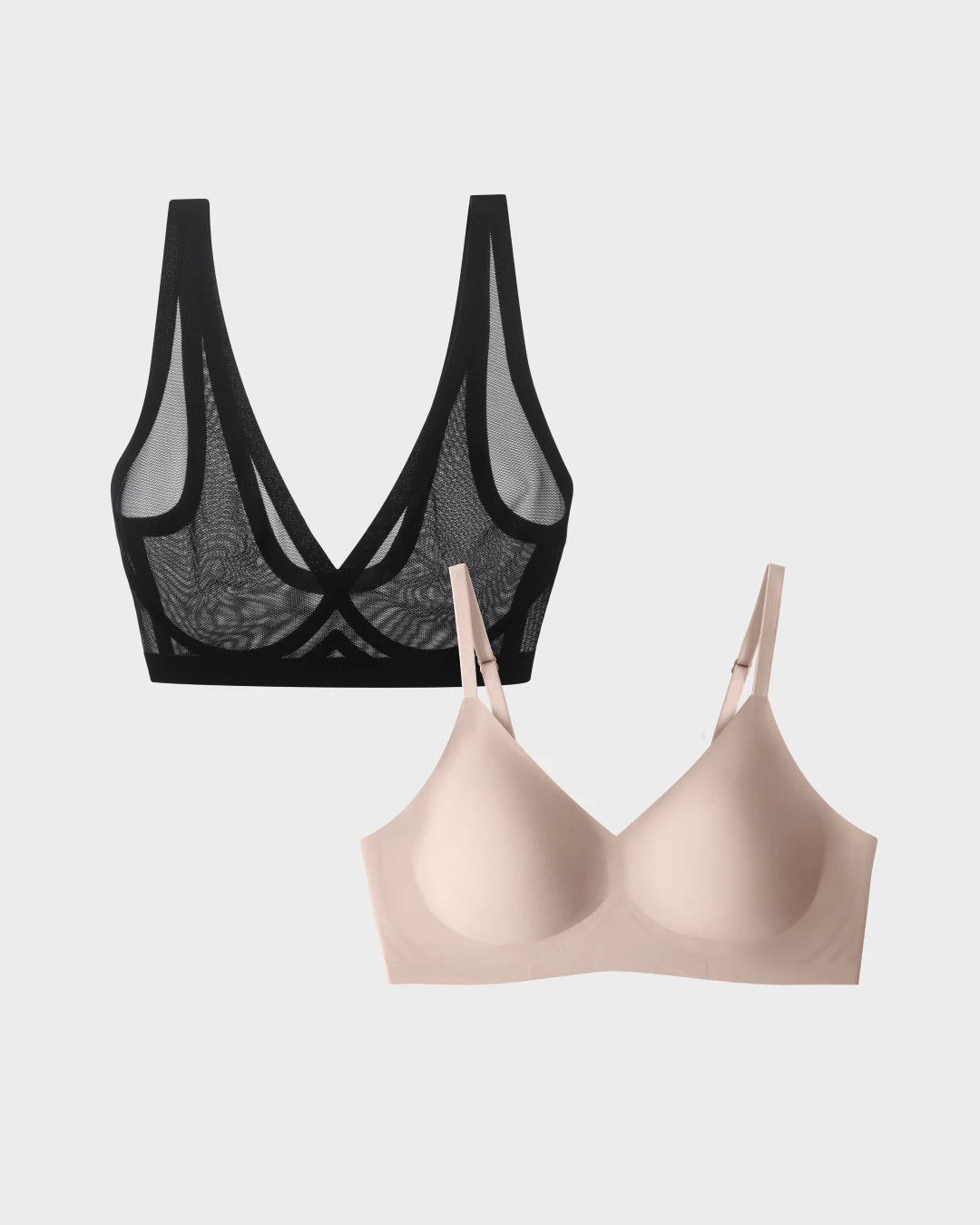 Black sheer mesh bralette paired with a smooth nude relief bra on grey.