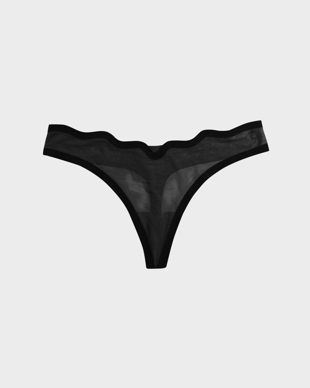 Black sheer mesh Lucy thong with scalloped waistband, flat-lay on light background.