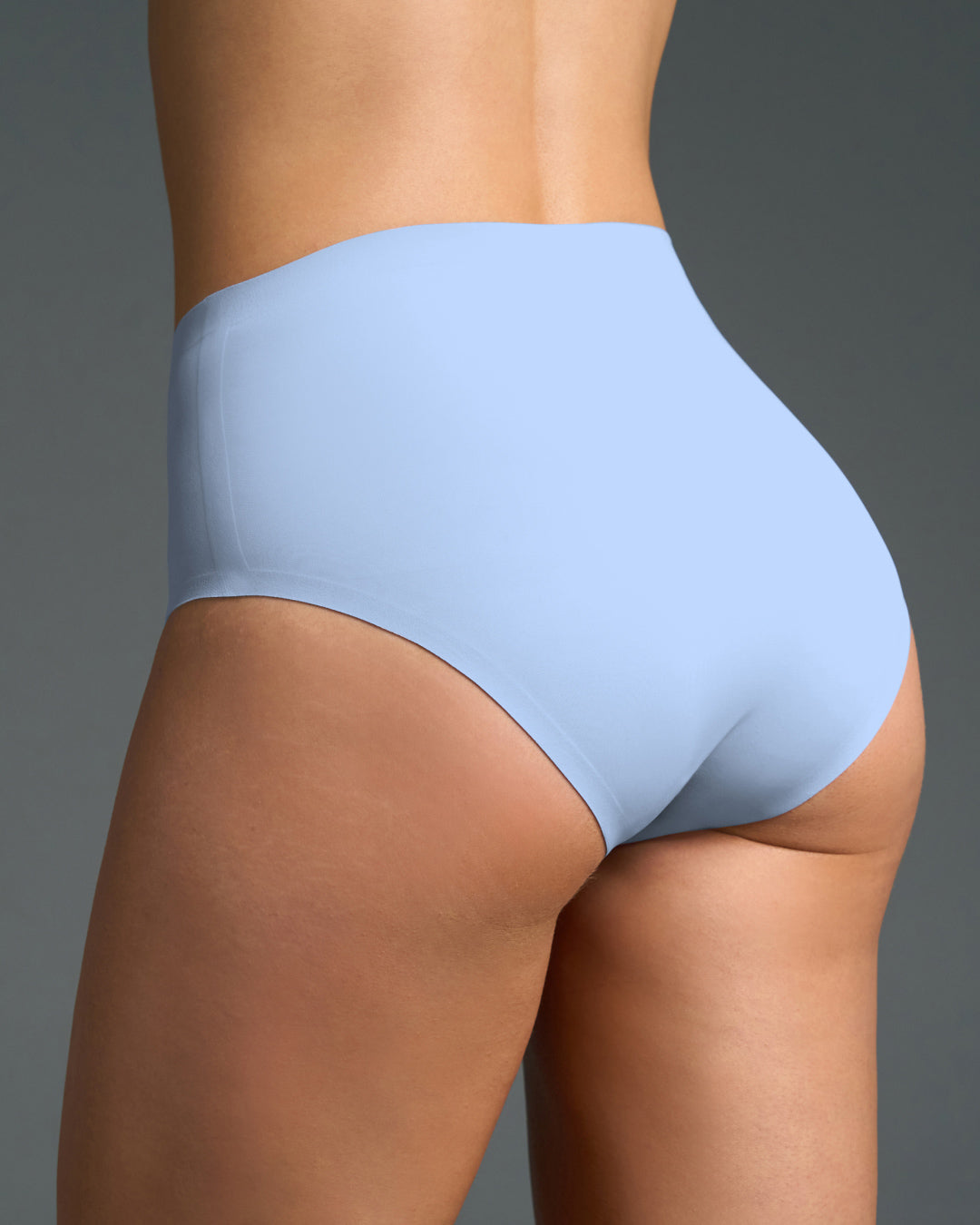 Light blue seamless high rise panties shown from the back, featuring smooth stretch fabric, seamless edges, and a flattering fit that provides invisible comfort under clothing