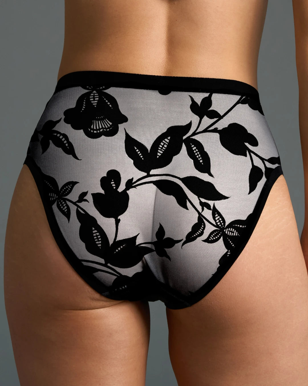 Back view of black floral sheer high-cut panty from the Madam Noir set.