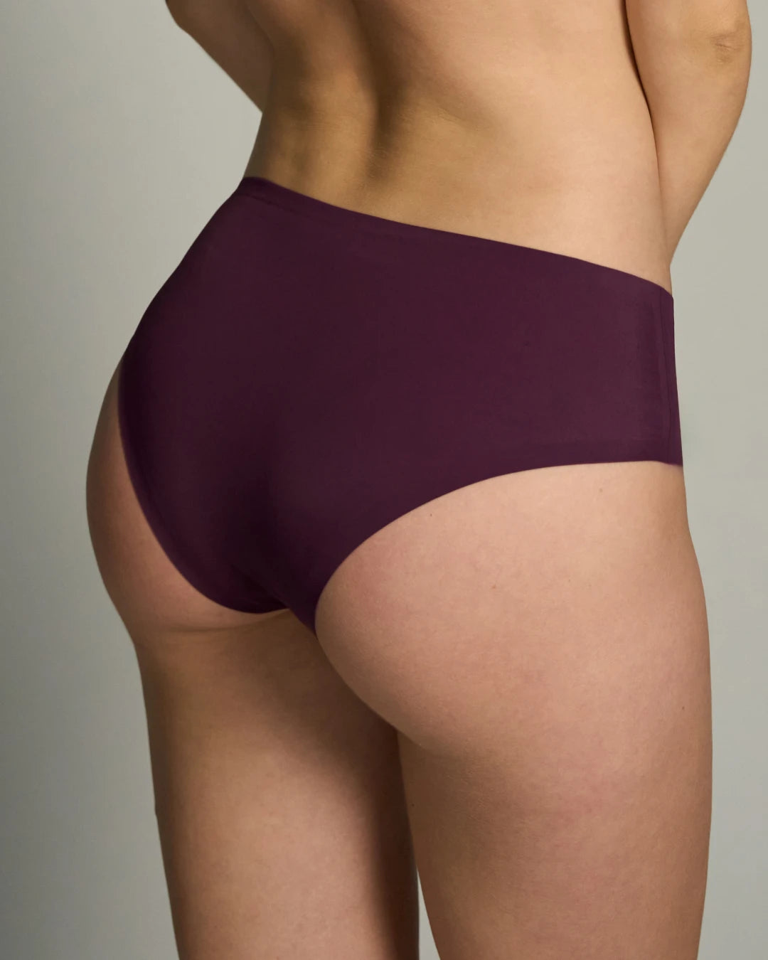 Back view of merlot seamless brief on model showing full coverage and no panty line.