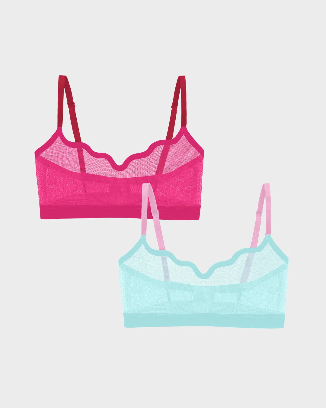 Two sheer mesh Lucy bralettes in red velvet pink and mint jelly with scalloped edges.