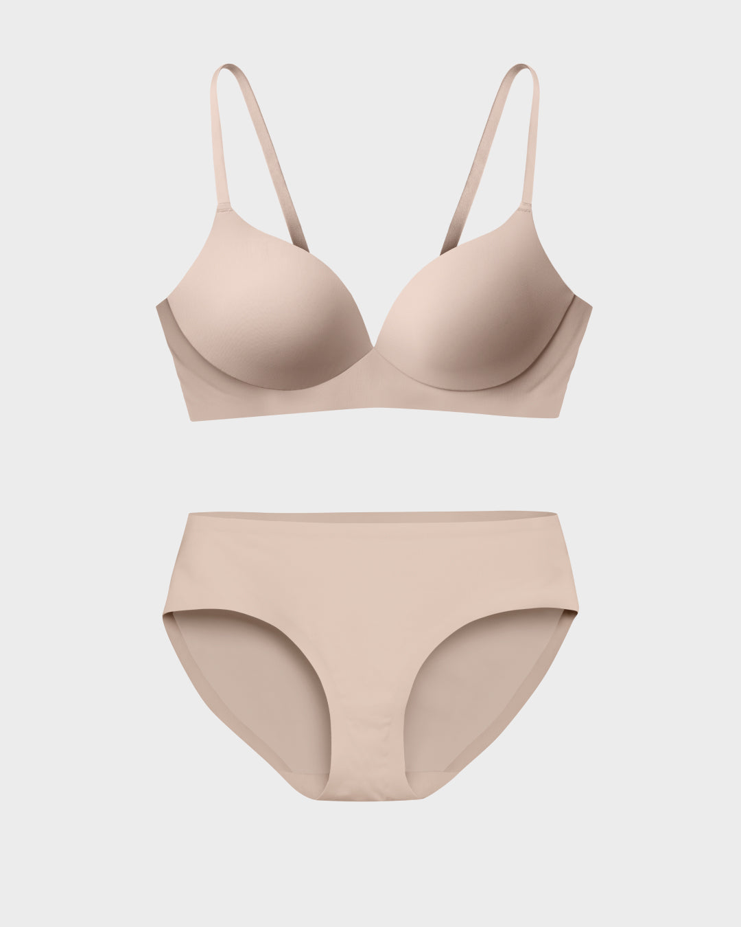 Nude wireless t-shirt bra and matching bikini panties set in a flat lay.