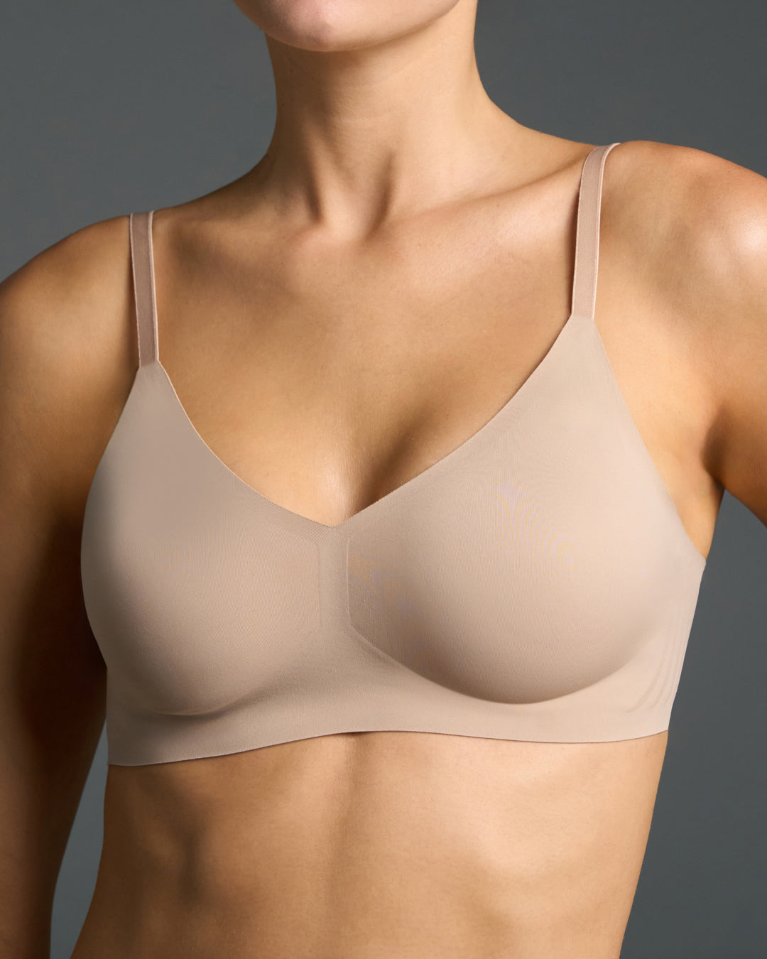 Back view of model wearing nude relief bra and high-waisted panties set.