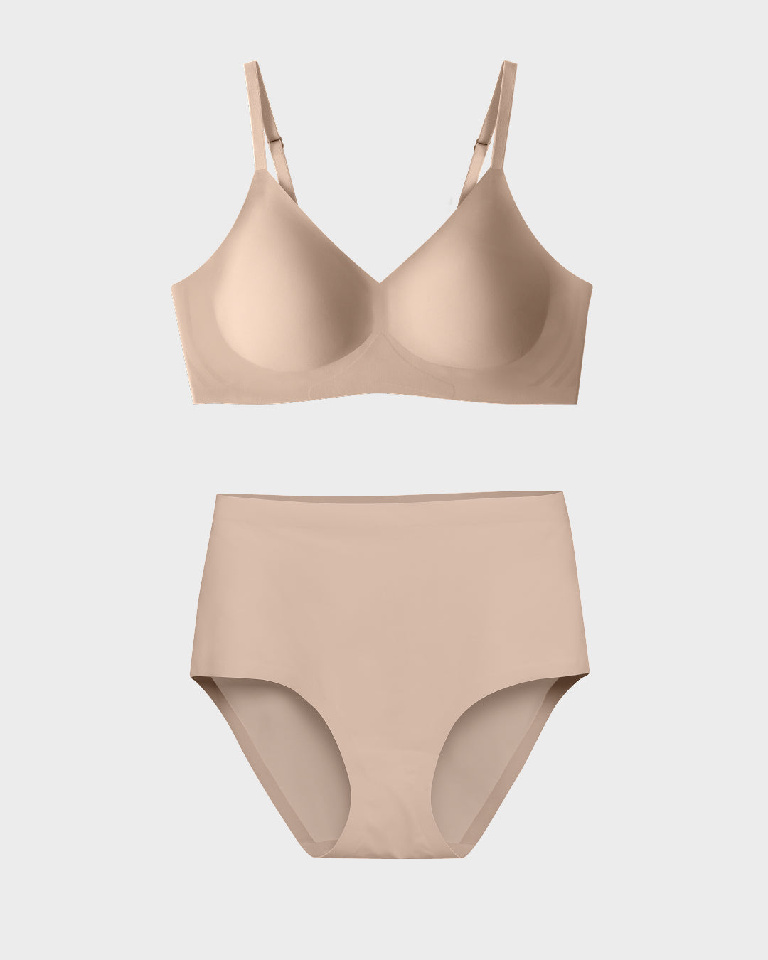 Nude seamless wireless bra and high-waisted brief set.