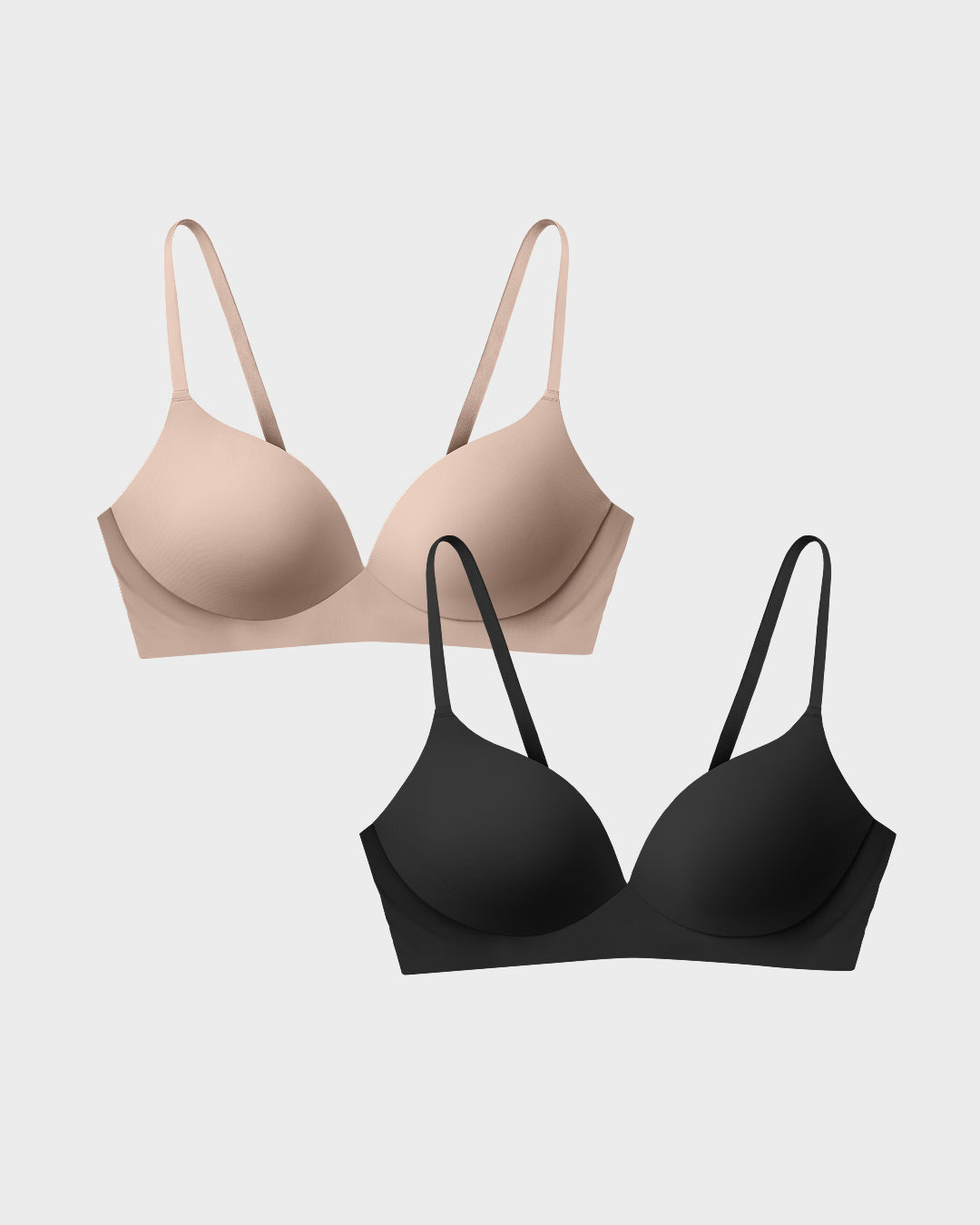 Wireless t-shirt bra two-pack in nude and black in a flat-lay arrangement.