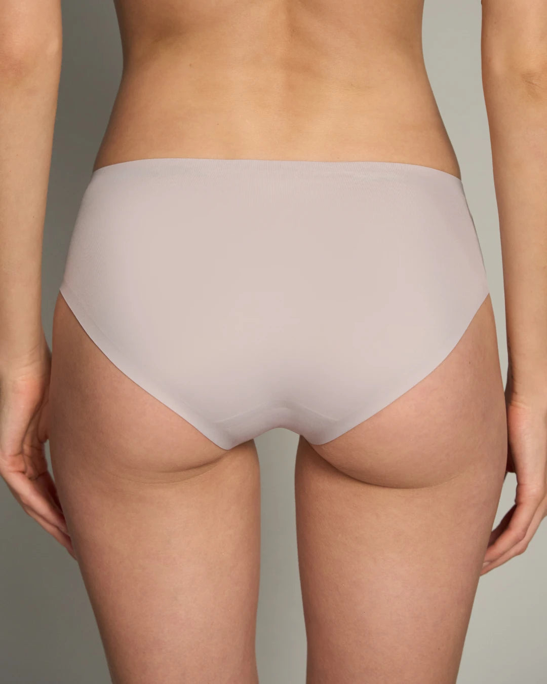 Back view of EBY Raindrop seamless brief in soft blush, showing full no-show coverage.