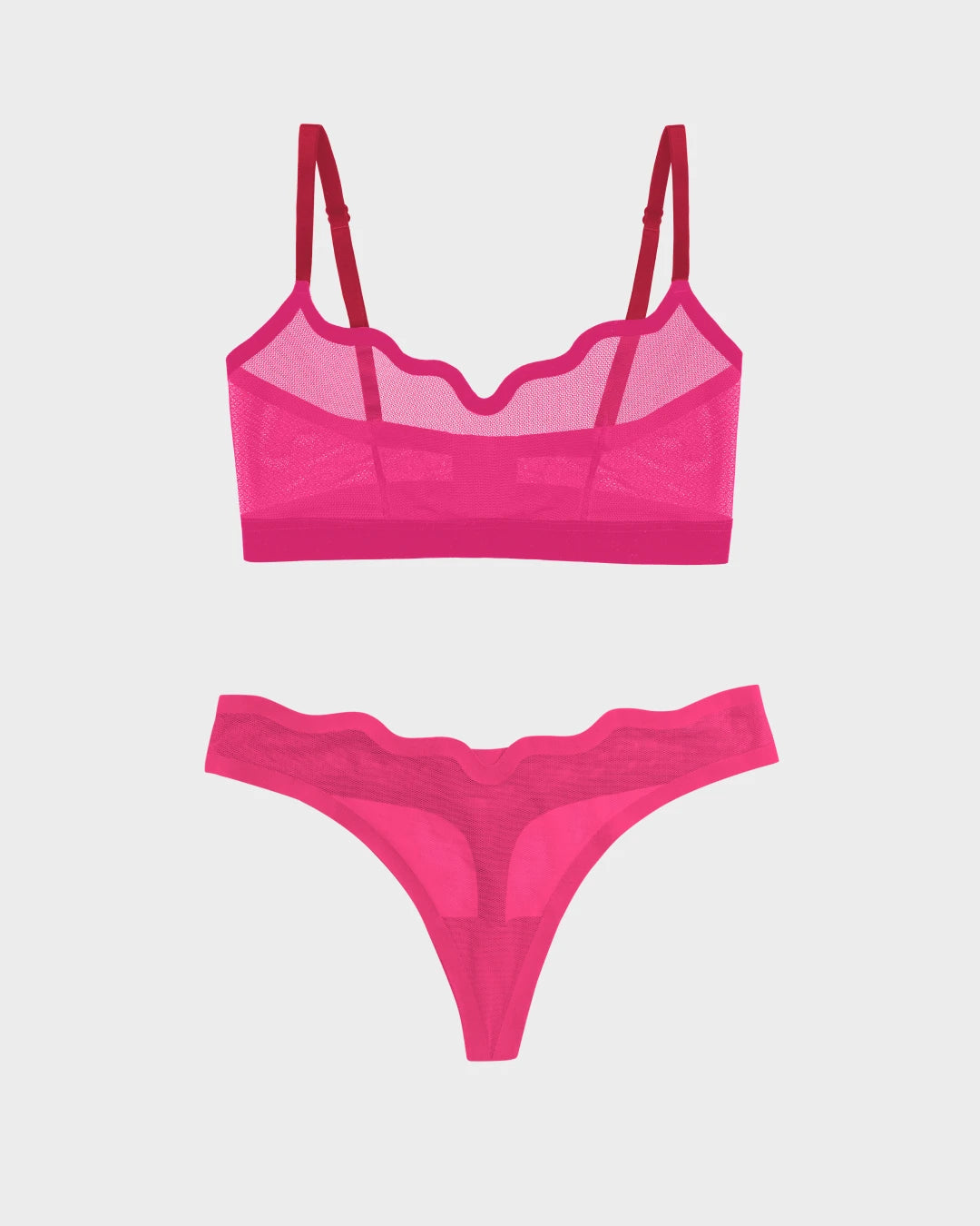 Lucy sheer mesh bra and panty set with scalloped neckline in vibrant pink.