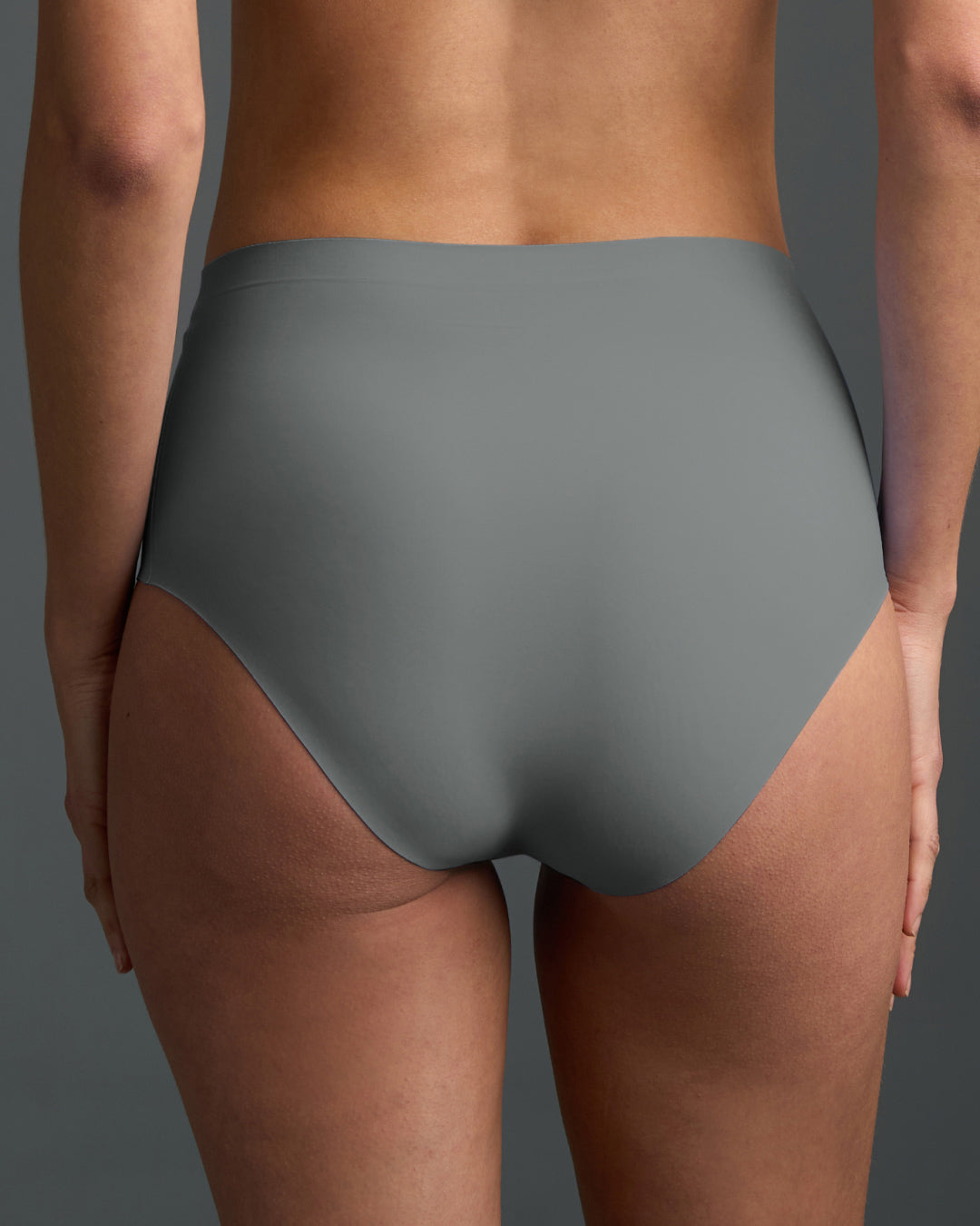 Gray seamless high rise panties shown from the back, featuring a smooth, stretchy fabric with laser-cut edges for a sleek, invisible look and all-day comfort
