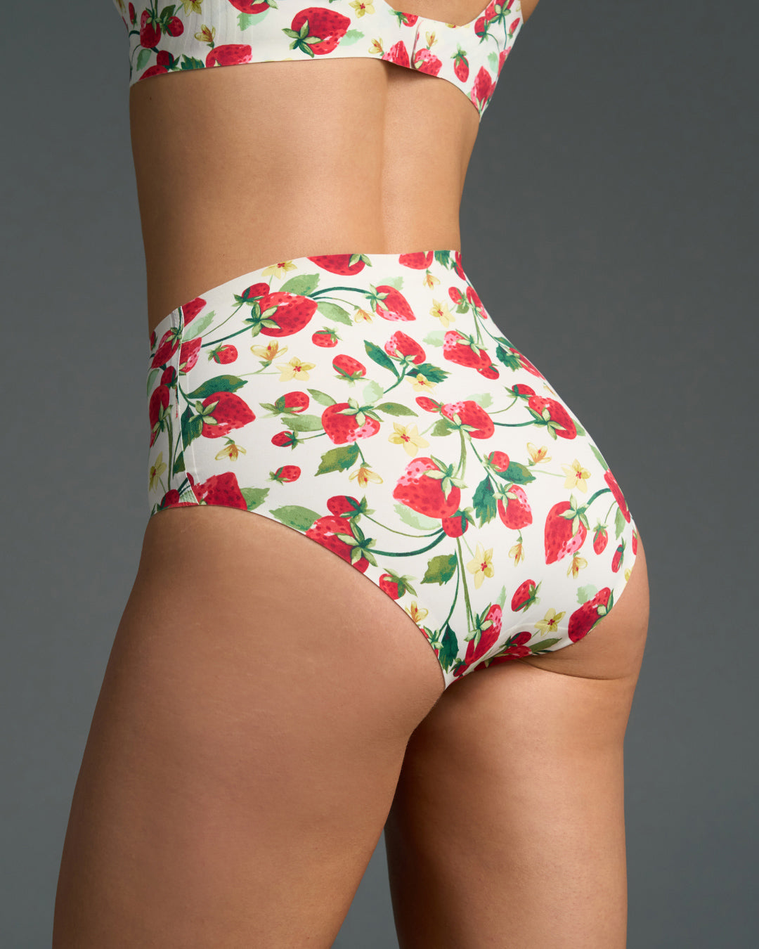 Strawberry patch seamless high rise panties shown from side view, featuring a white base and smooth edges for an invisible, comfortable fit