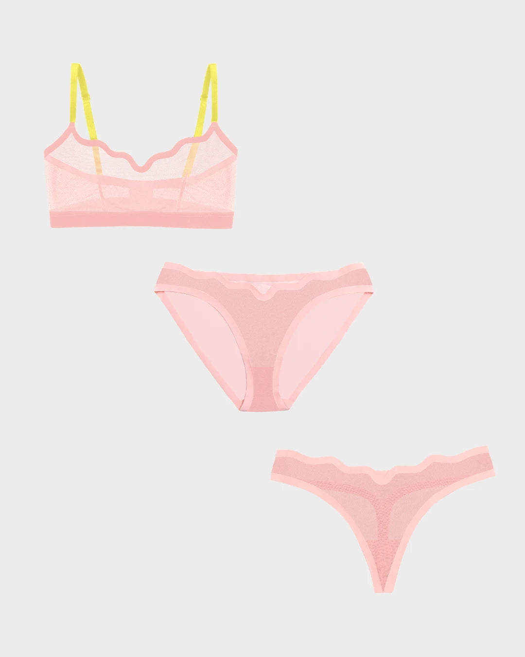Pink sheer Lucy bralette with yellow straps, matching bikini, and thong set.