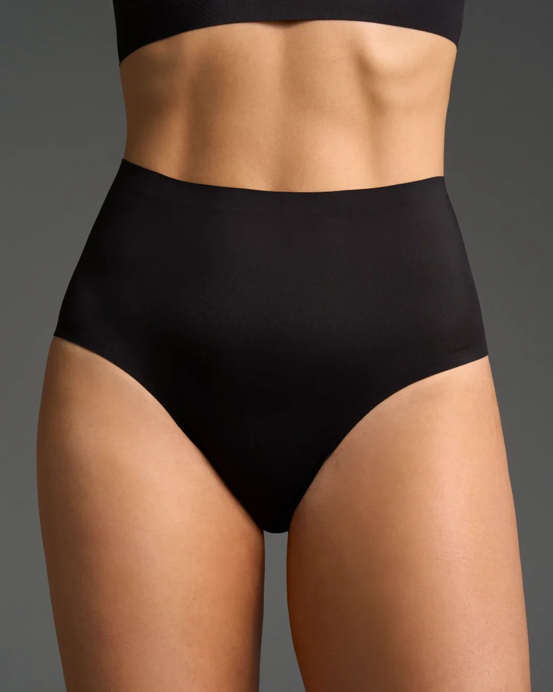 Black high rise seamless panties with a smooth finish.