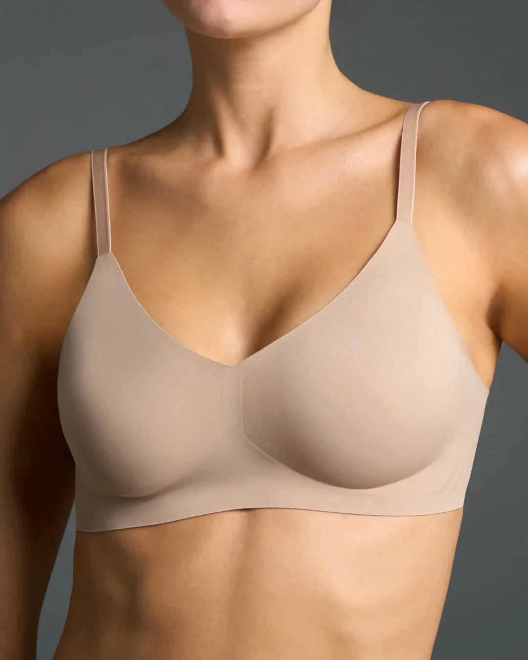 Nude no seam bralette with a V-neckline and adjustable straps.